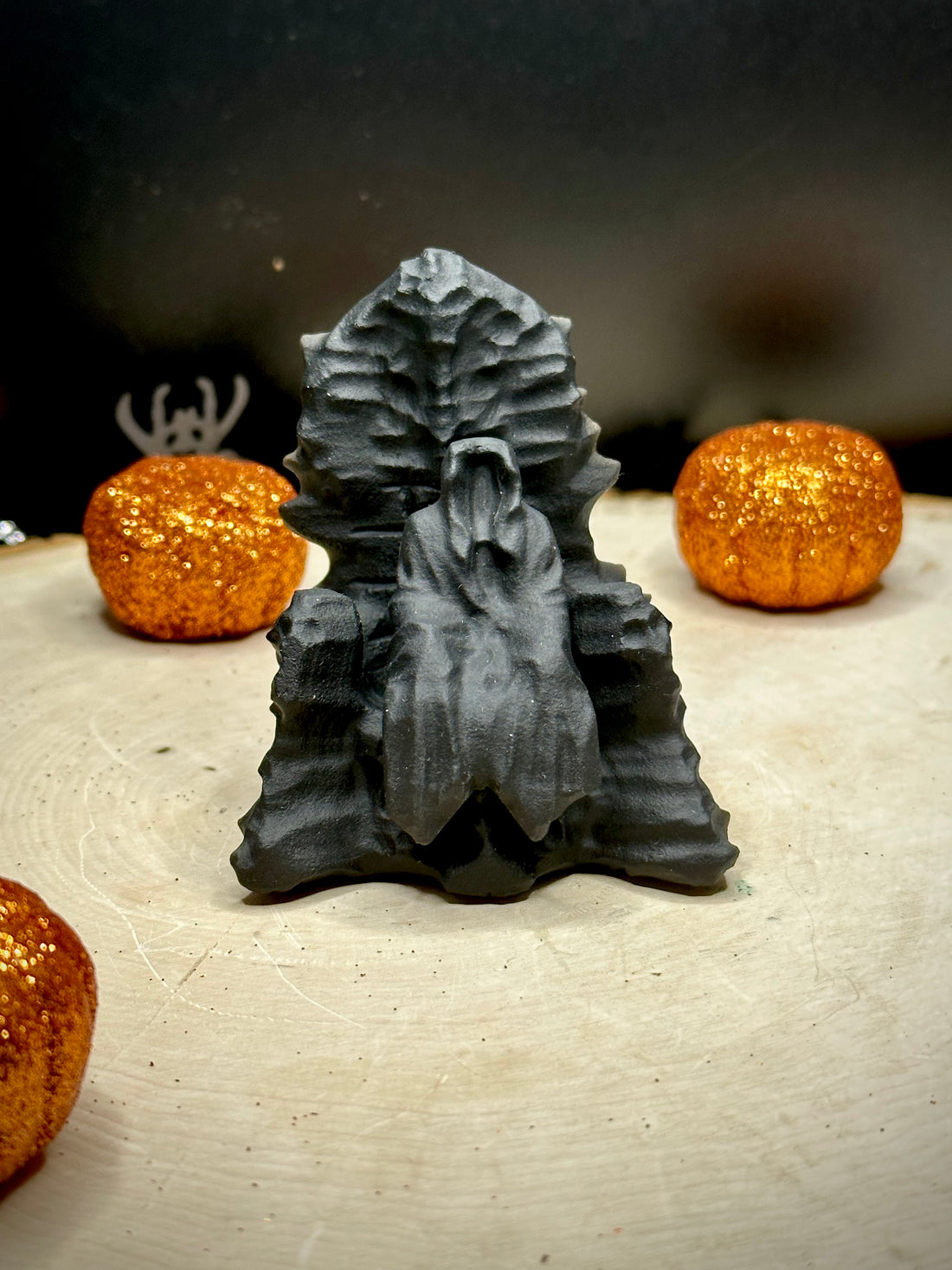 Death Sitting On Throne Carving