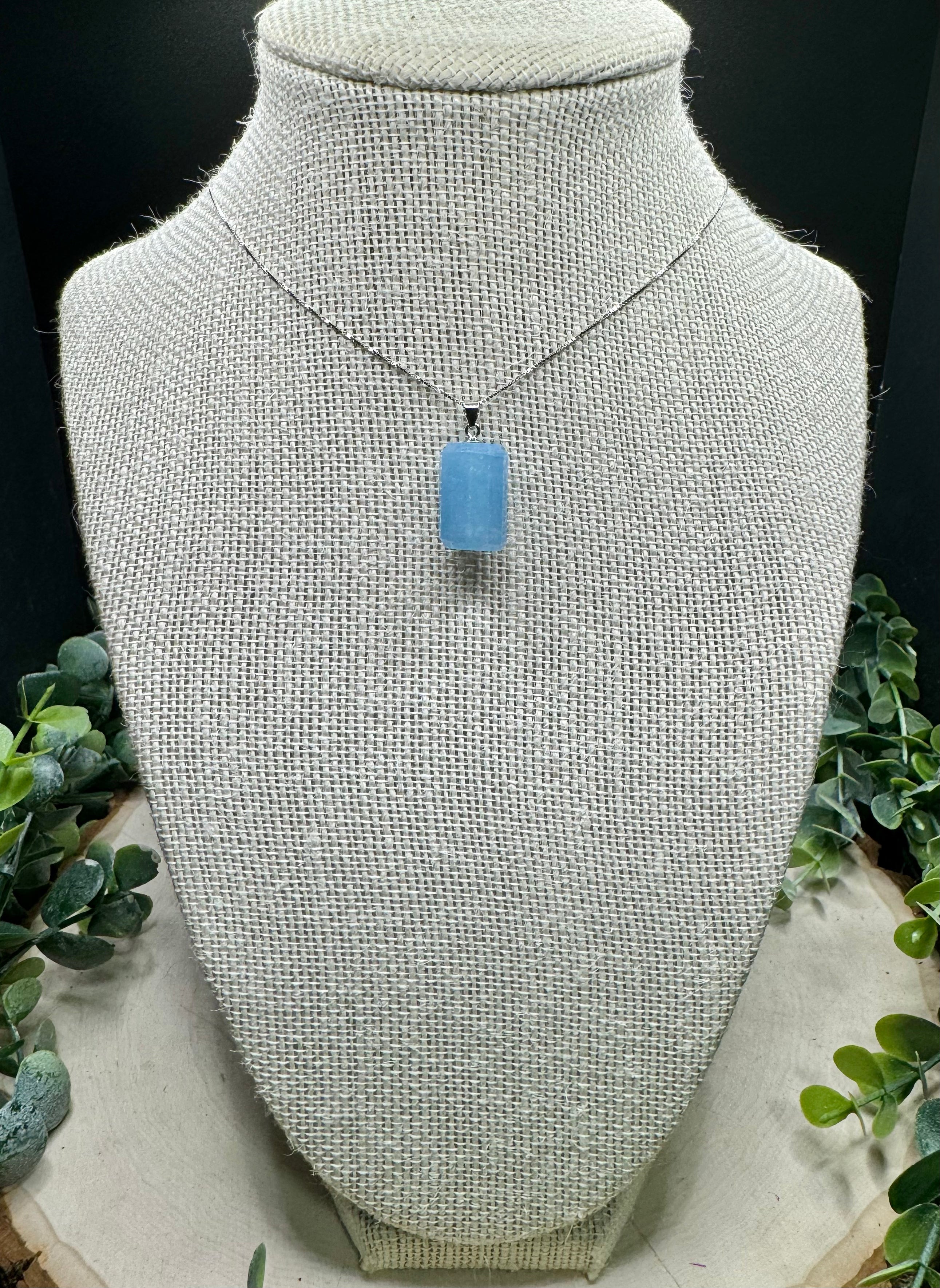 Second view of faceted pale blue aquamarine cylinder pendant